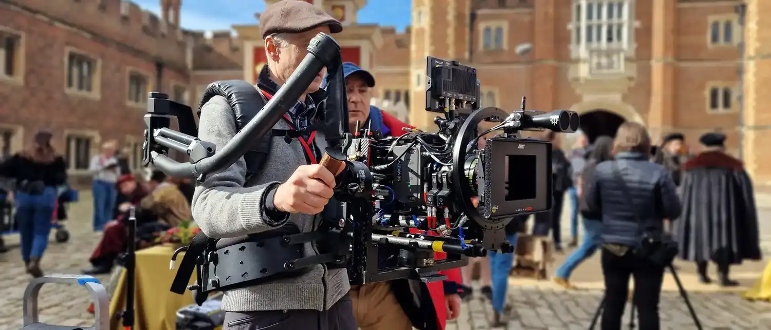 A unit filming in the courtyard of a historic house.