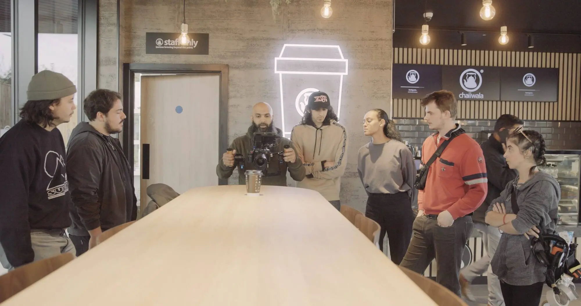 Wide of the coffee shop set with crew in position