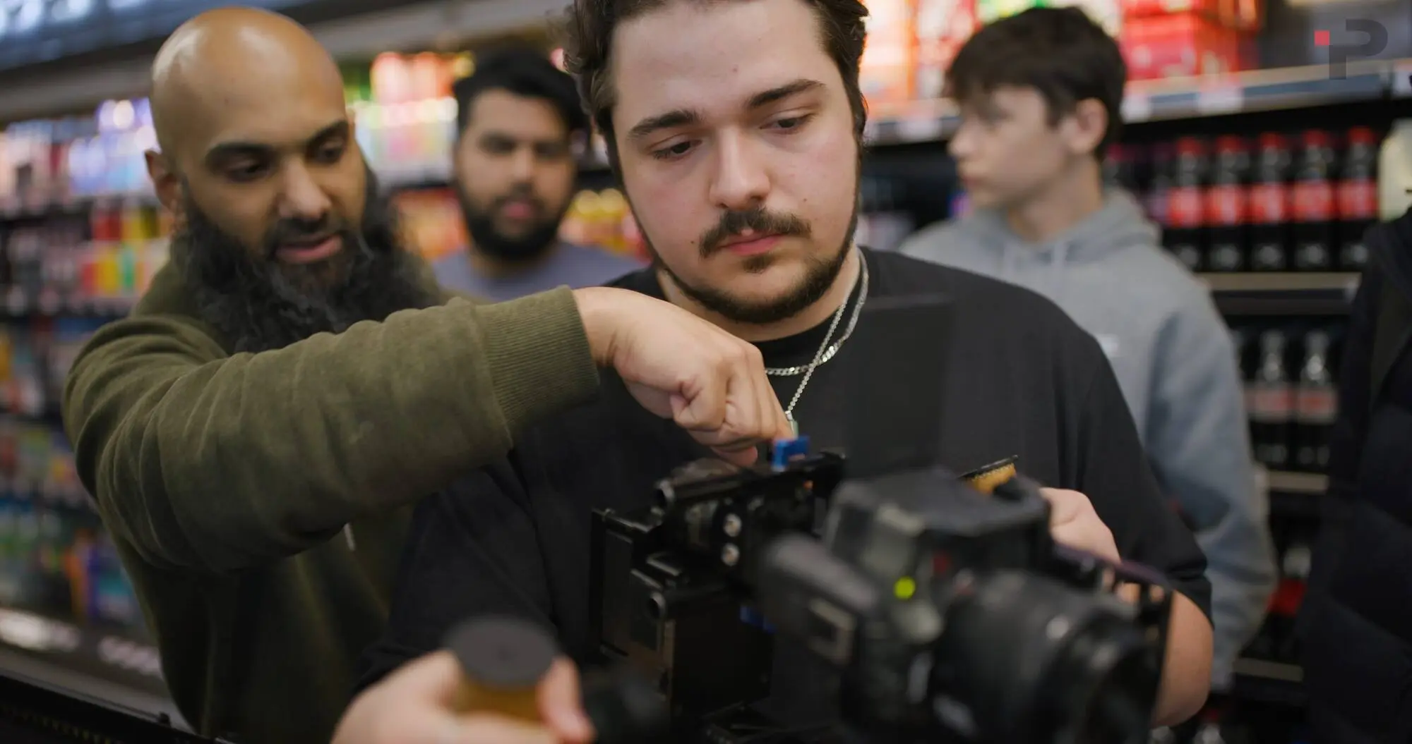 Instructor pointing out a control on the camera