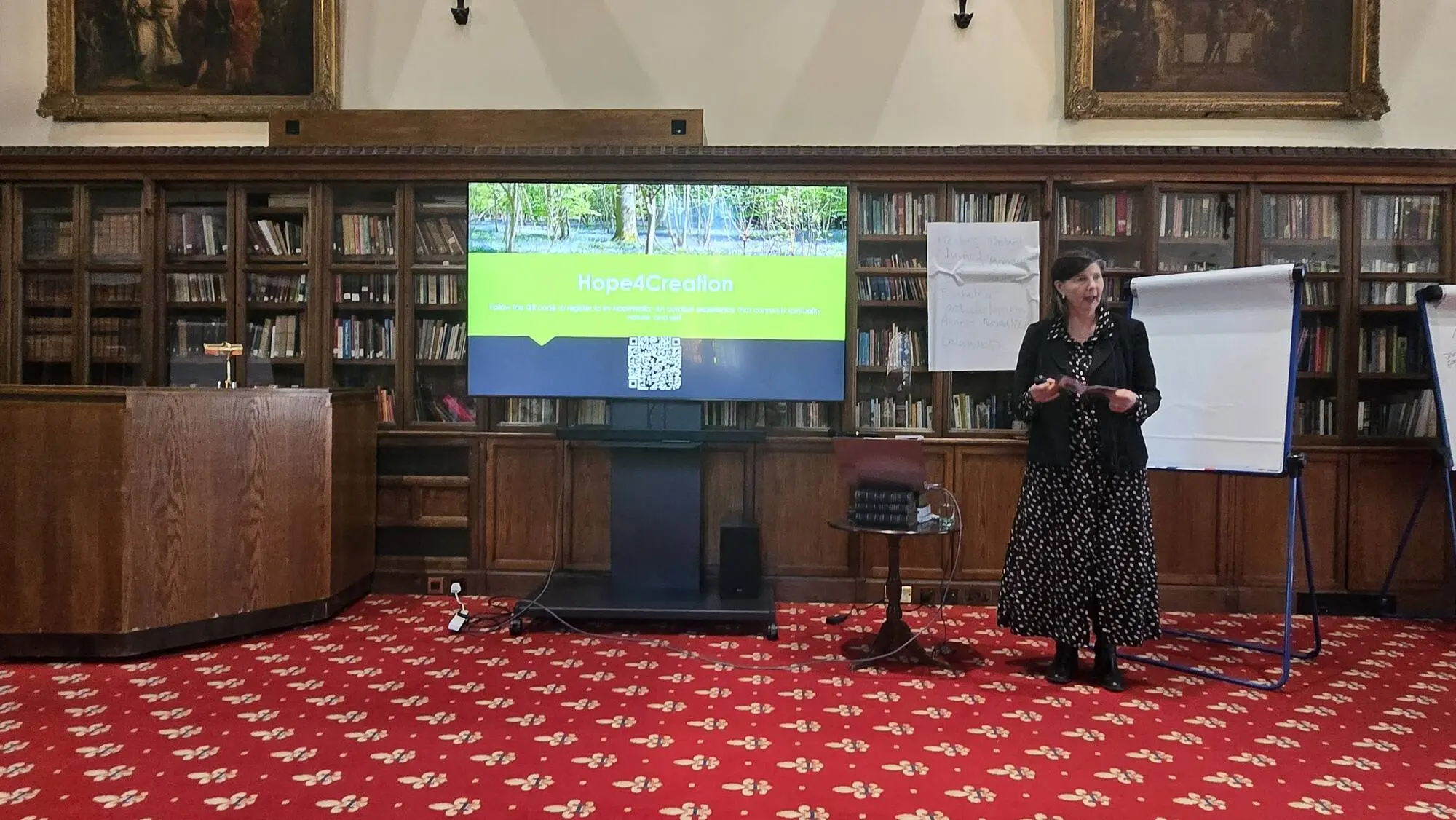 A speaker at the front of the library room